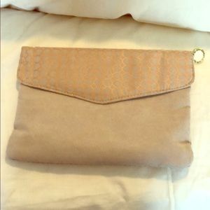 Useful and elegant clutch/travel pouch.